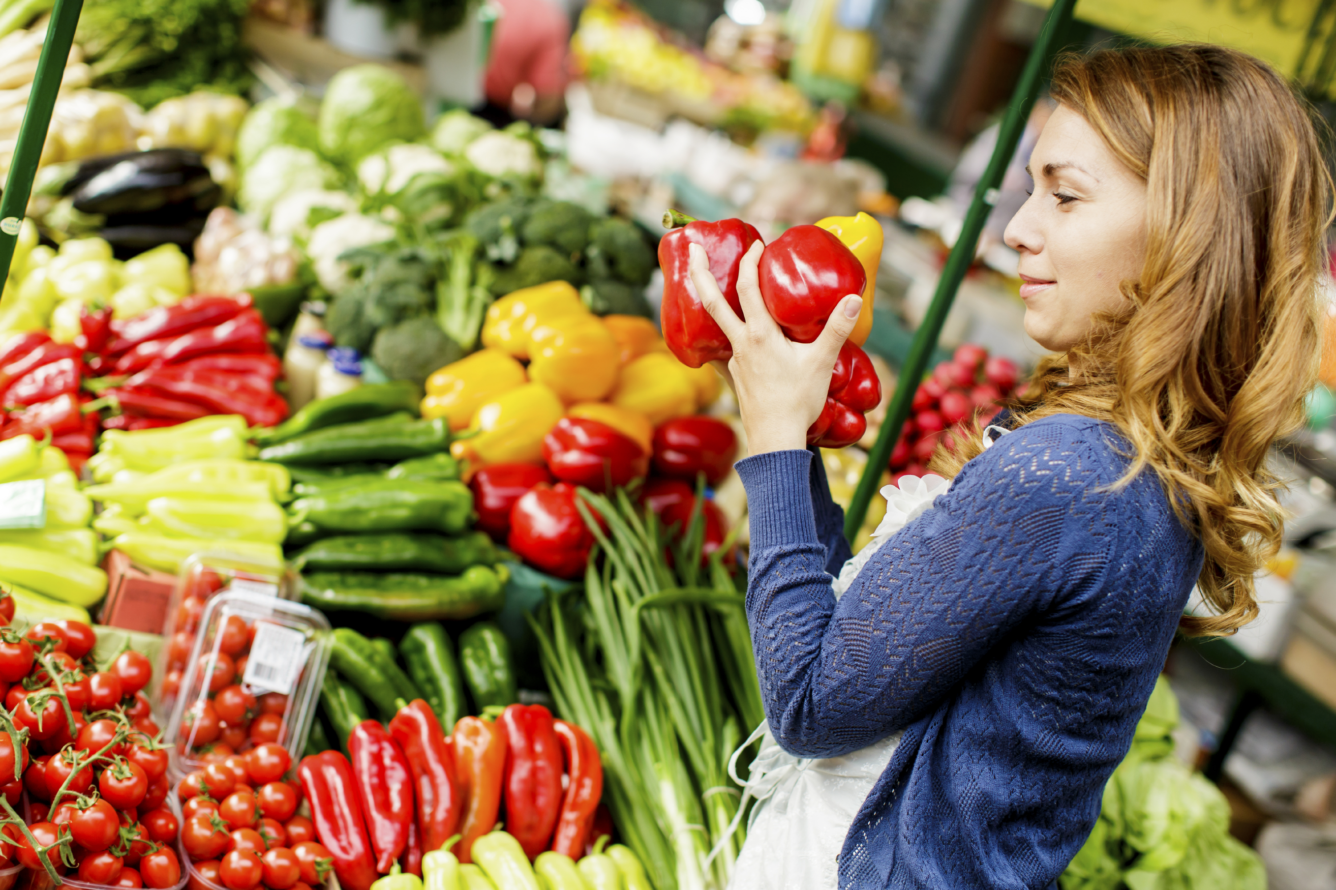 Woman buying vegetables at the market