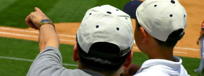 father and son at a baseball game